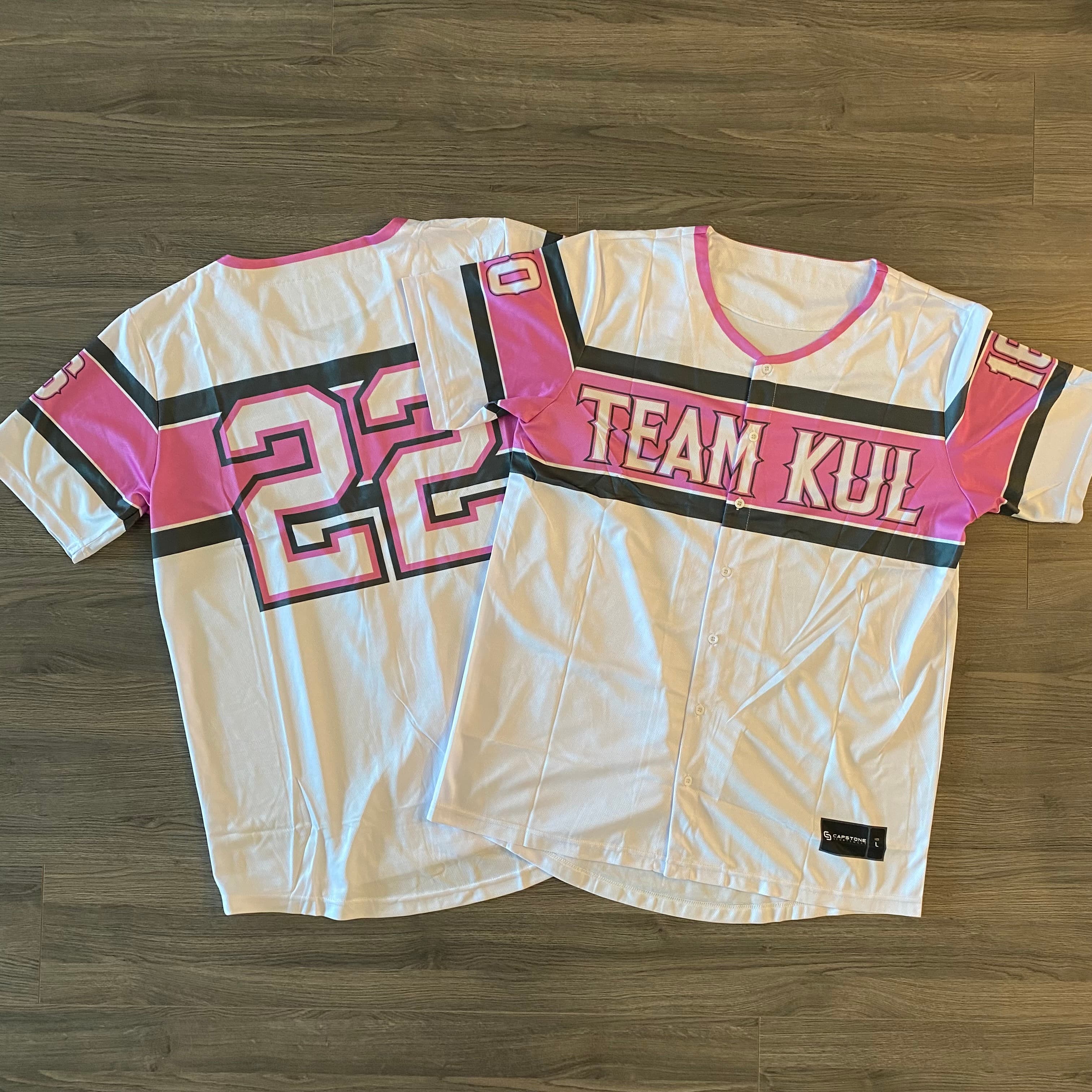 Team KUL custom baseball jerseys — white and pink