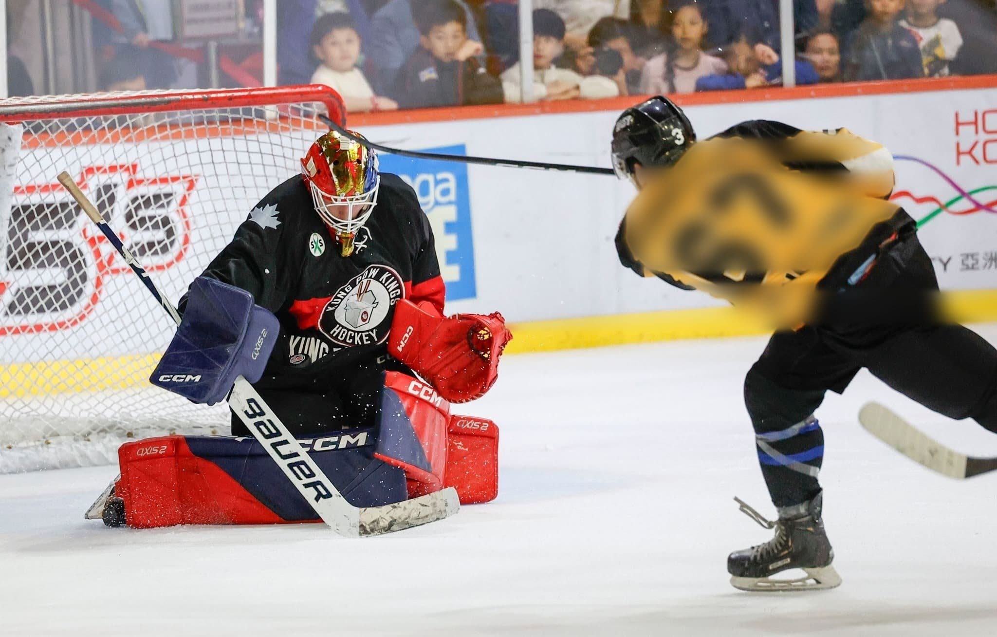 Hockey game action — custom Capstone Sportswear jerseys